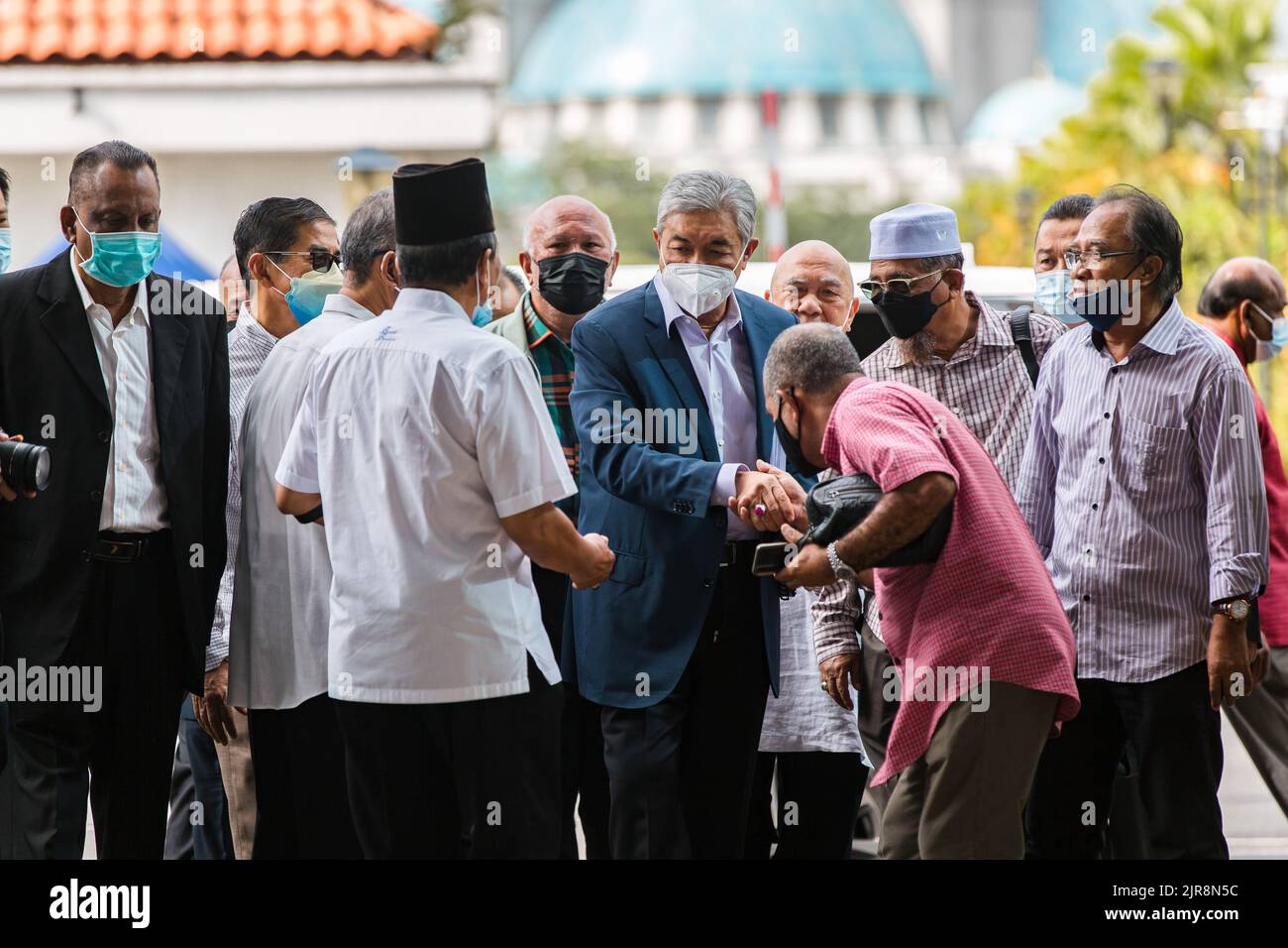 Kuala Lumpur, Malaysia. 23rd Aug, 2022. Former Deputy Prime Minister and UMNO President Zahid Hamidi (C) arrives at KL High Court to attend the proceeding. Zahid Hamidi pleaded not guilty to 47 charges, 12 of which are for criminal breach of trust involving RM31.06 million (US$7.4 million) of funds belonging to charitable foundation Yayasan Akalbudi, eight counts of bribery charges amounting to RM21.25 million, and 27 charges for money laundering involving RM72 million as income from illegal activities. Credit: SOPA Images Limited/Alamy Live News Stock Photo
