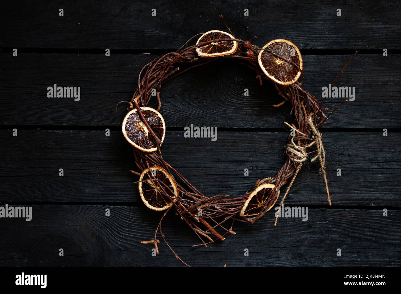 new year christmas wreath on an old wooden table, decor for the holiday, dry vine wreath Stock Photo