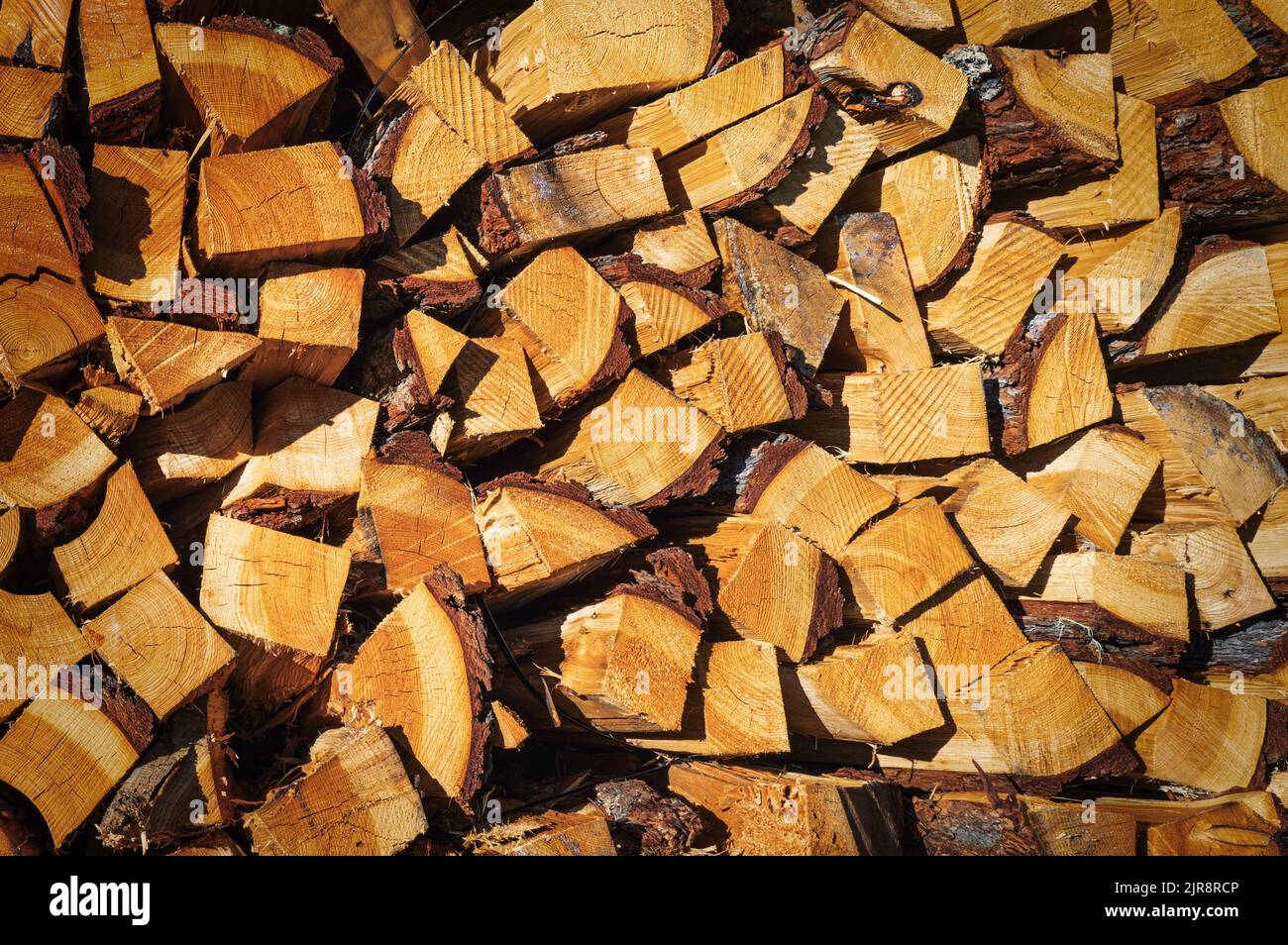 Firewood cut and stacked ready to be burned Stock Photo Alamy