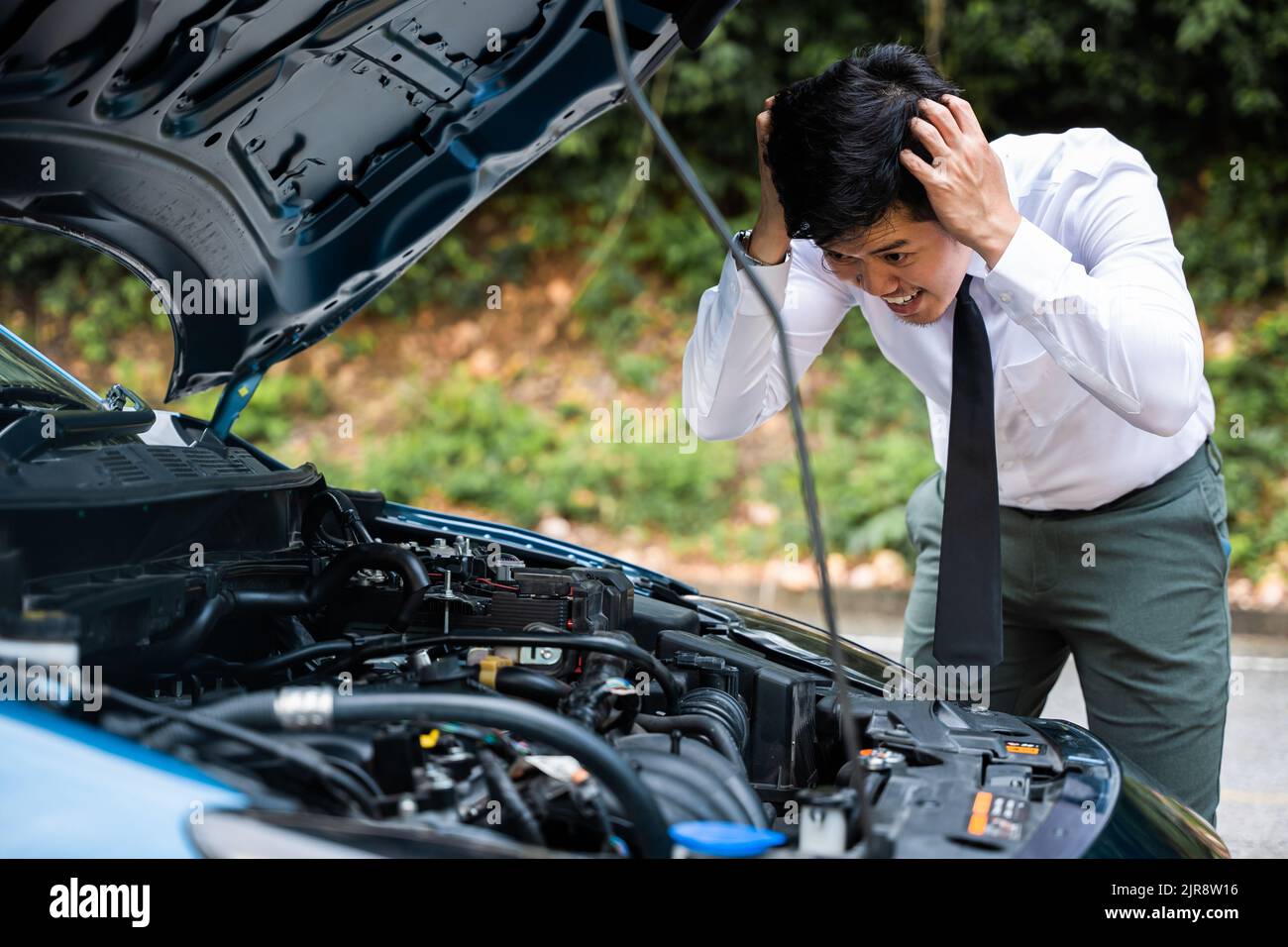 Asian businessman car broken breakdown, young stressed man having