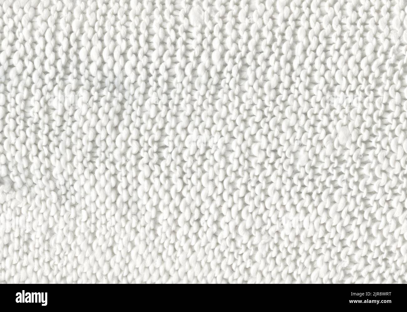 White knitted boho fabric texture with blank space for ads. Knitted