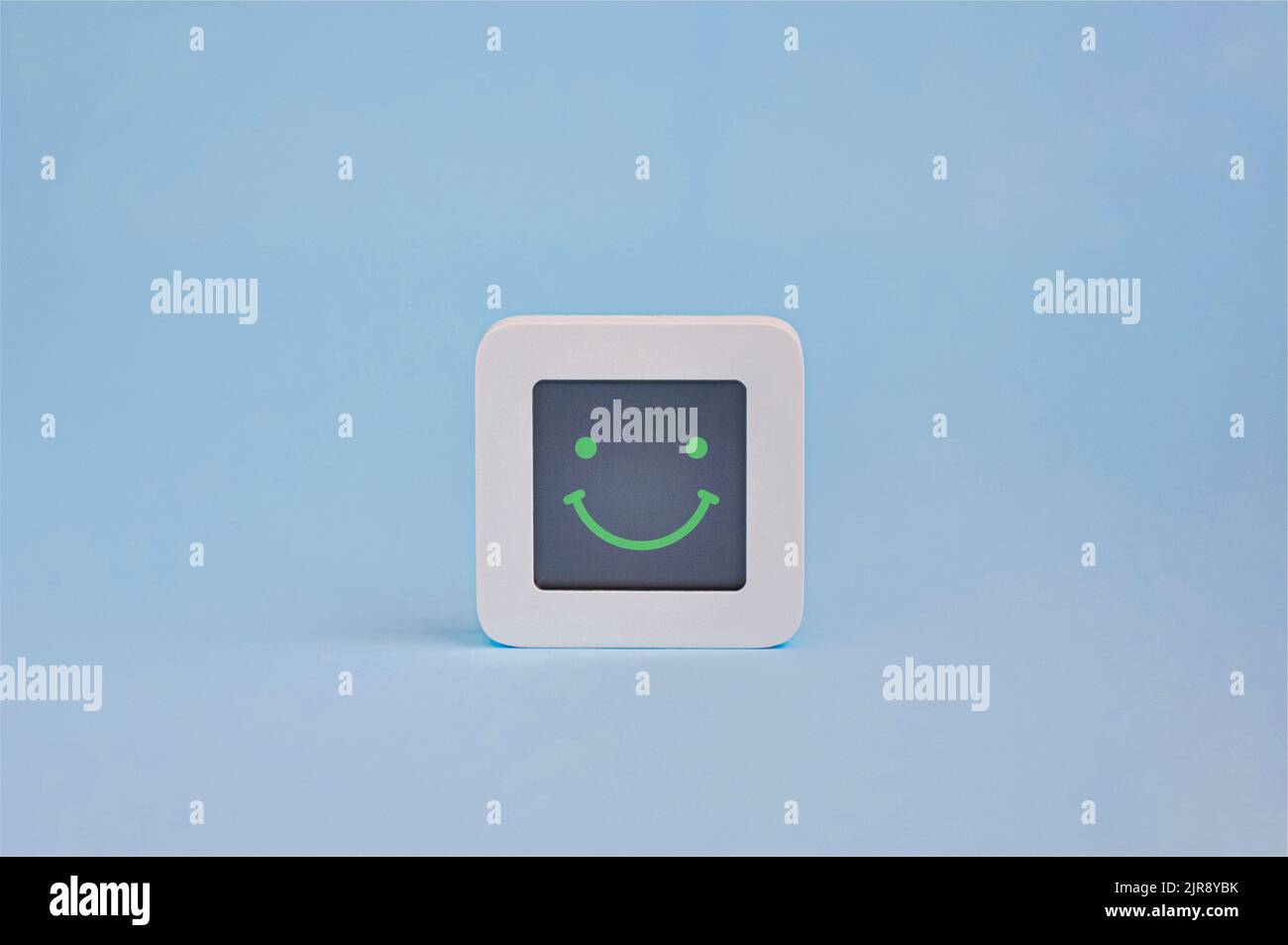 Happy emotion concept, symbol of smiley emoticon on lcd display isolated on colored background, Customer Experience Concept Stock Photo