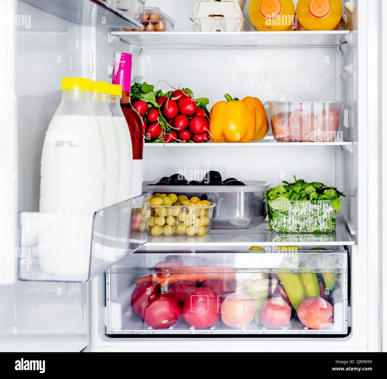 Fridge with fruits and vegetables Stock Photo