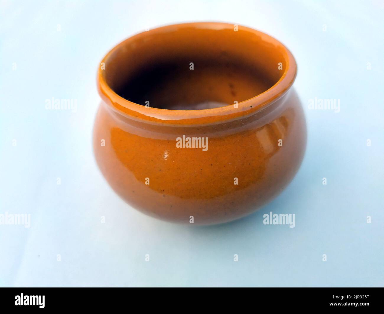 Brown clay pot isolated on white background Stock Photo - Alamy