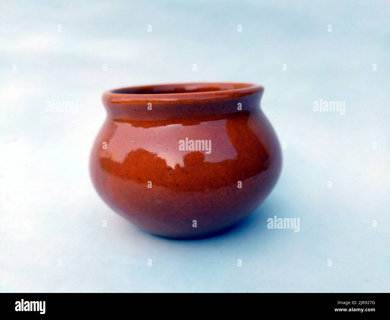 Brown clay pot isolated on white background Stock Photo - Alamy