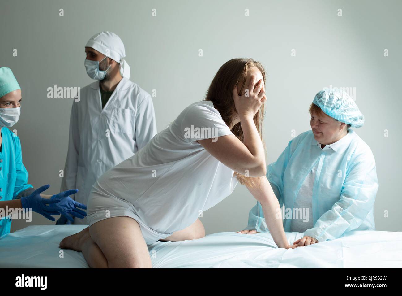 Child birth process, helping personal during natural labour Stock Photo