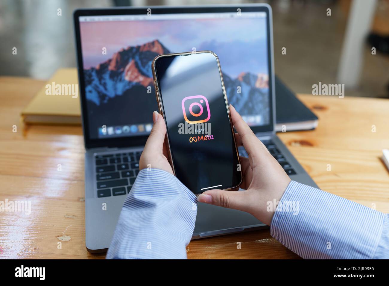 CHIANG MAI, THAILAND - AUG 23, 2022 : A woman hand holding iphone with search page screen of instagram application. Instagram is largest and most Stock Photo