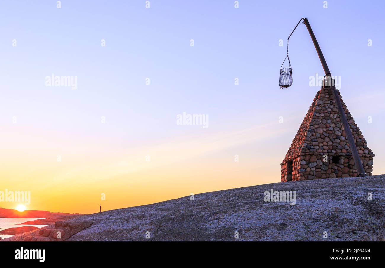 Sunrise at the end of the world - Vippefyr ancient lighthouse at Verdens Ende in Norway Stock Photo