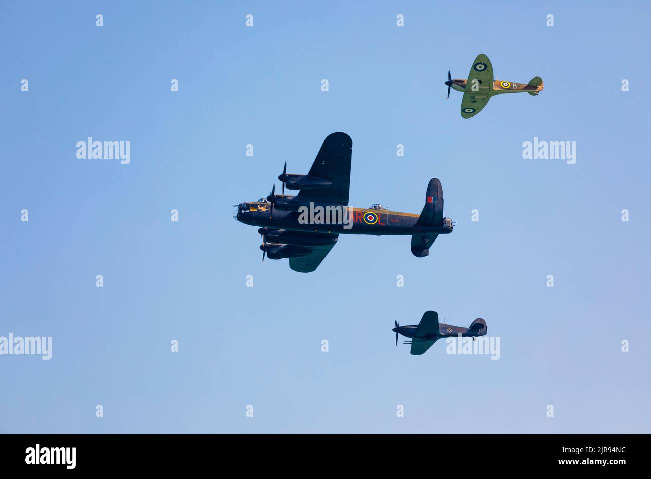 Battle of Britain Memorial Flight.  Lancaster, Spitfire and Hurricane flying. Stock Photo