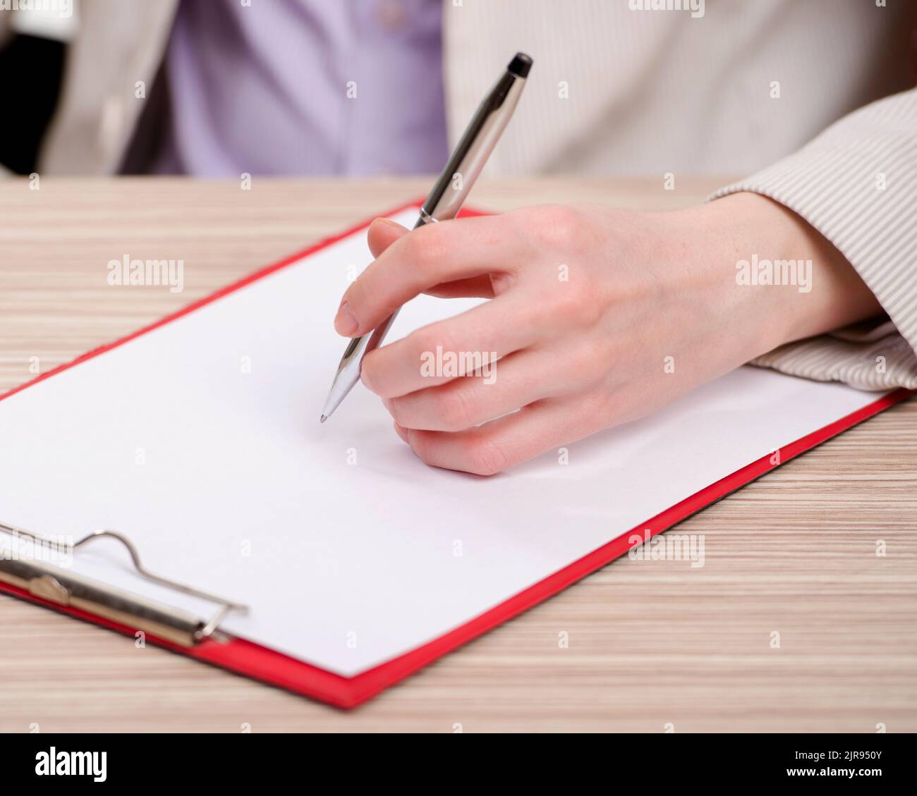 The hands taking notes in the pad Stock Photo - Alamy