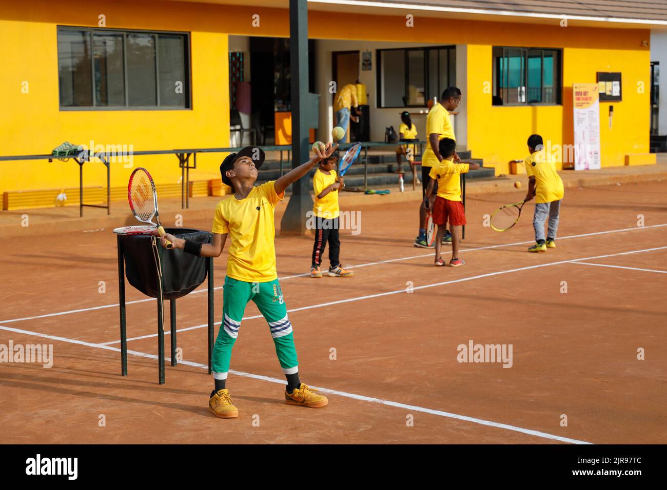 Coach and young children at JayÕs Institute of Tennis in Trichy