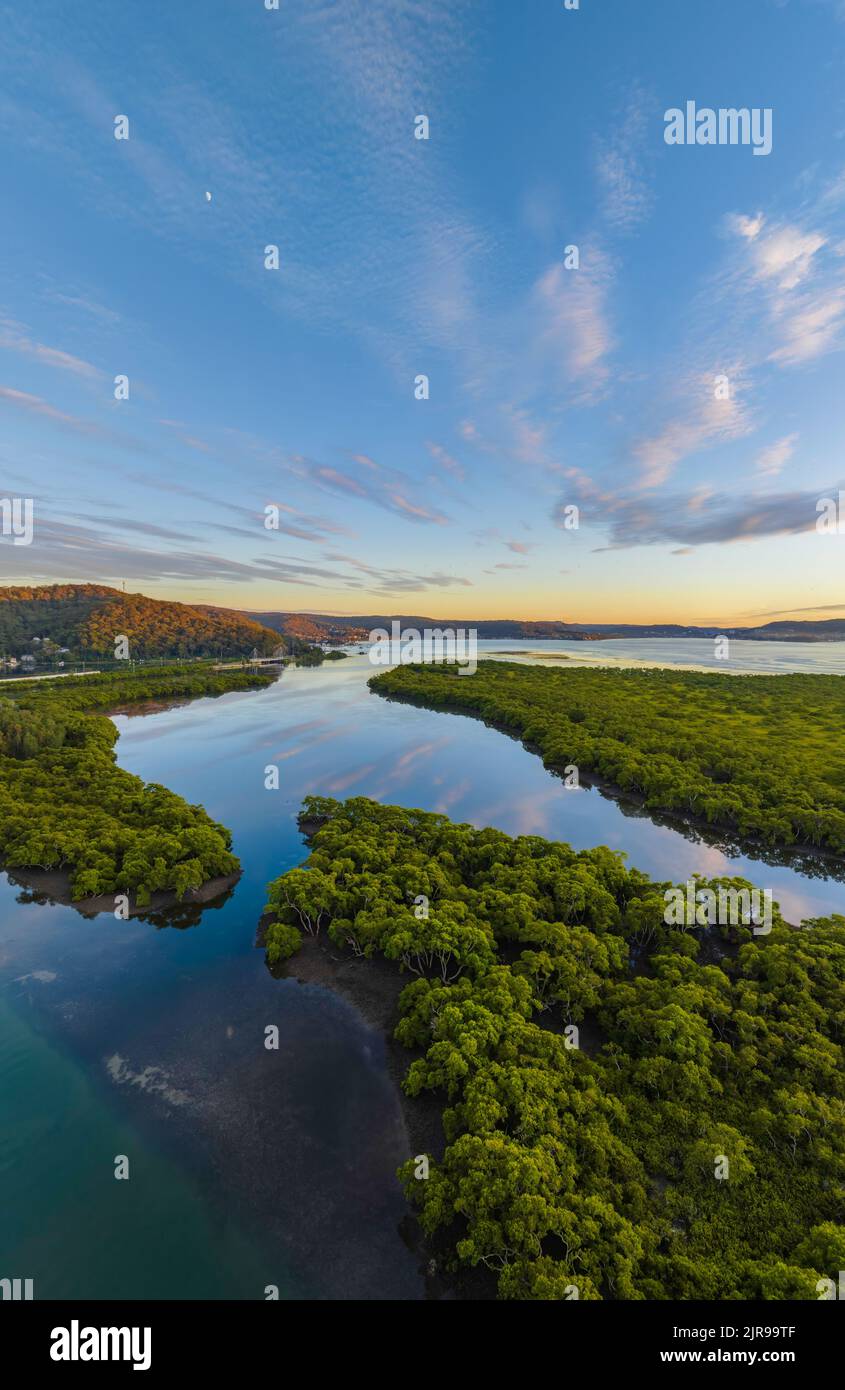 Aerial sunrise over the bay with high cloud at Woy Woy on the Central Coast, NSW, Australia. Stock Photo