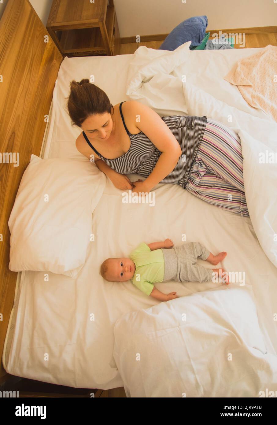 Mother and newborn baby sleep in the bed Stock Photo Alamy