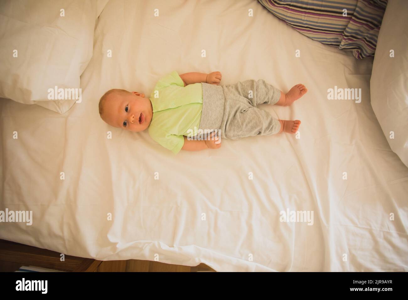 Mother and newborn baby sleep in the bed together Stock Photo