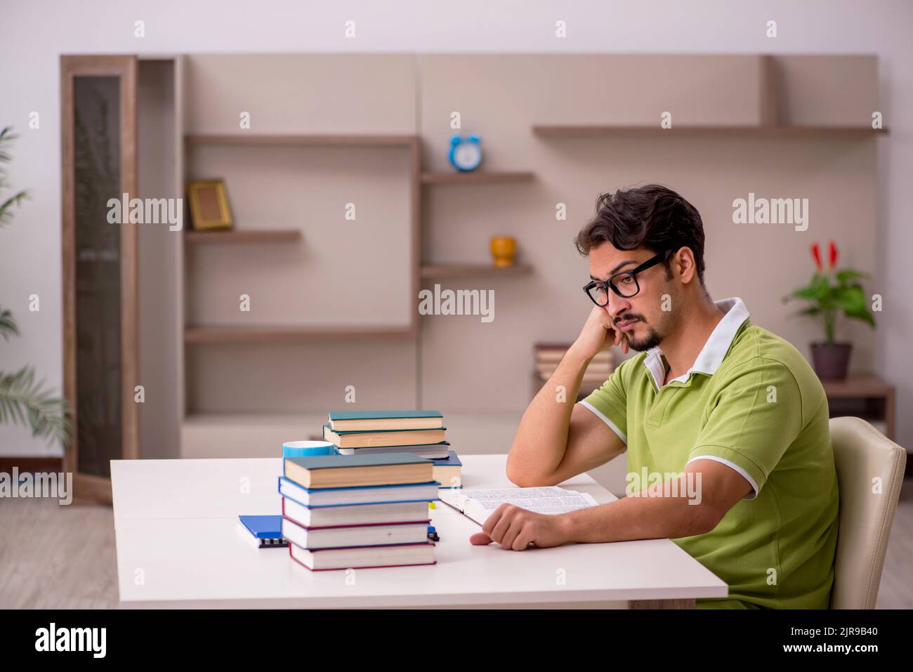 Young student studying at home Stock Photo - Alamy