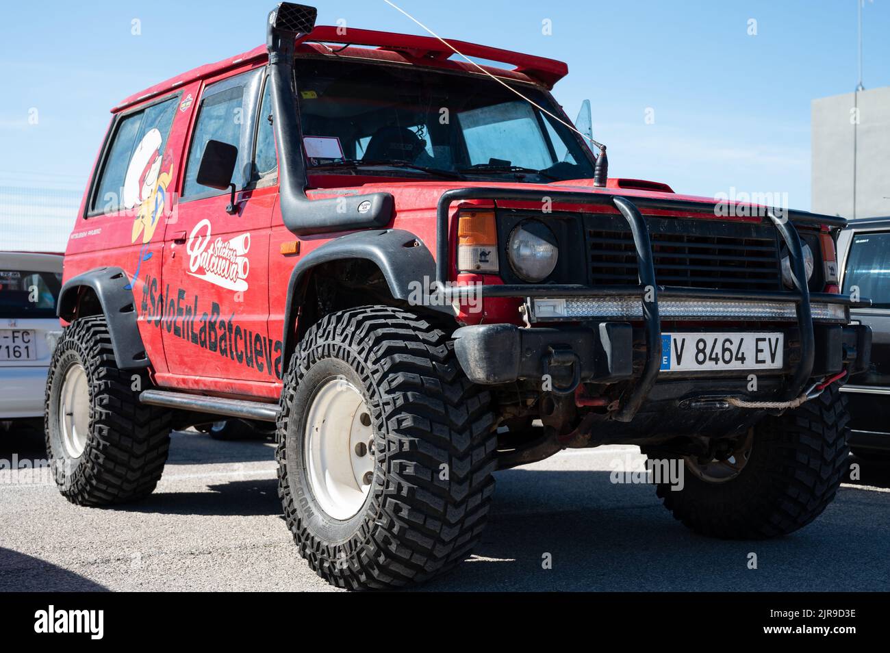 An old red all-terrain Mitsubishi Montero parked on the street Stock Photo