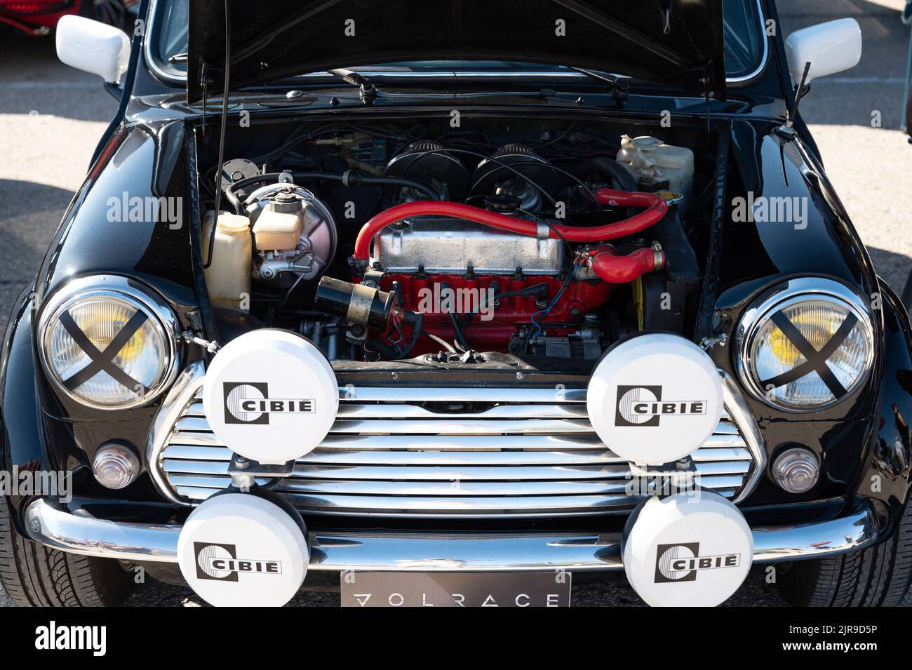 A detail of an old black Mini Cooper with an open hood Stock Photo