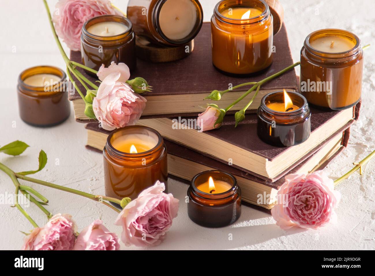 A set of different aroma candles in brown glass jars. Scented handmade ...