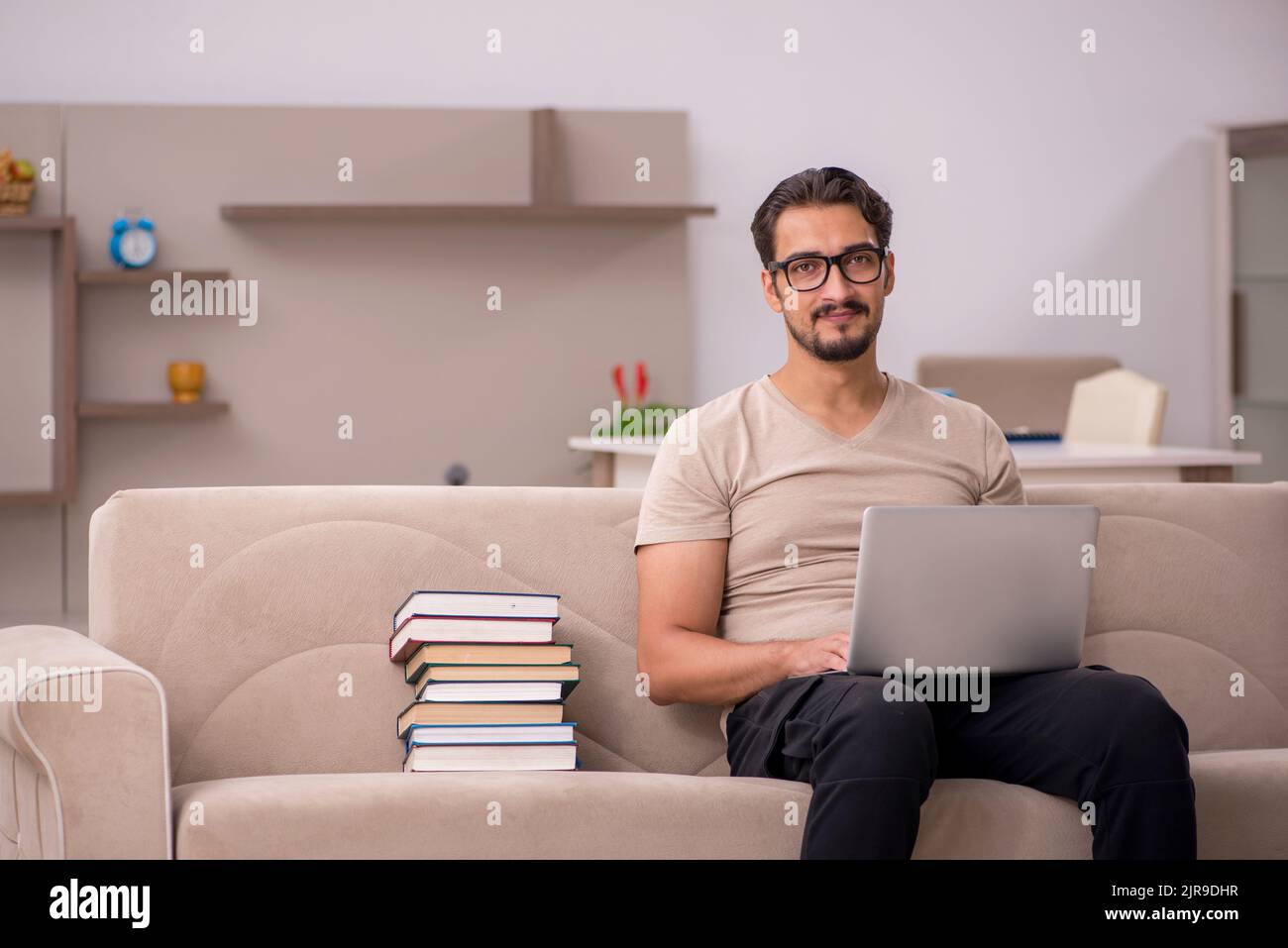 Young student studying at home during pandemic Stock Photo - Alamy