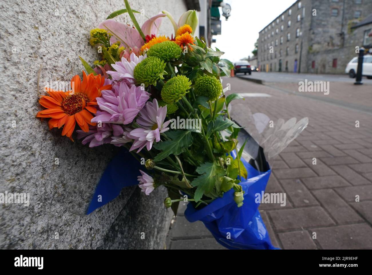 Flowers at the scene in Monasterevin, Co Kildare, where Dylan McCarthy, from Kilmallock in County Limerick was assaulted on Sunday and later died Tallaght University Hospital on Monday. Picture date: Tuesday August 23, 2022. Stock Photo