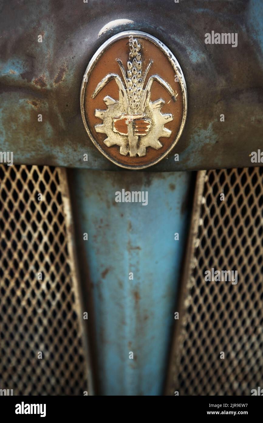 Badge on front of vintage blue Fordson tractor. Stock Photo