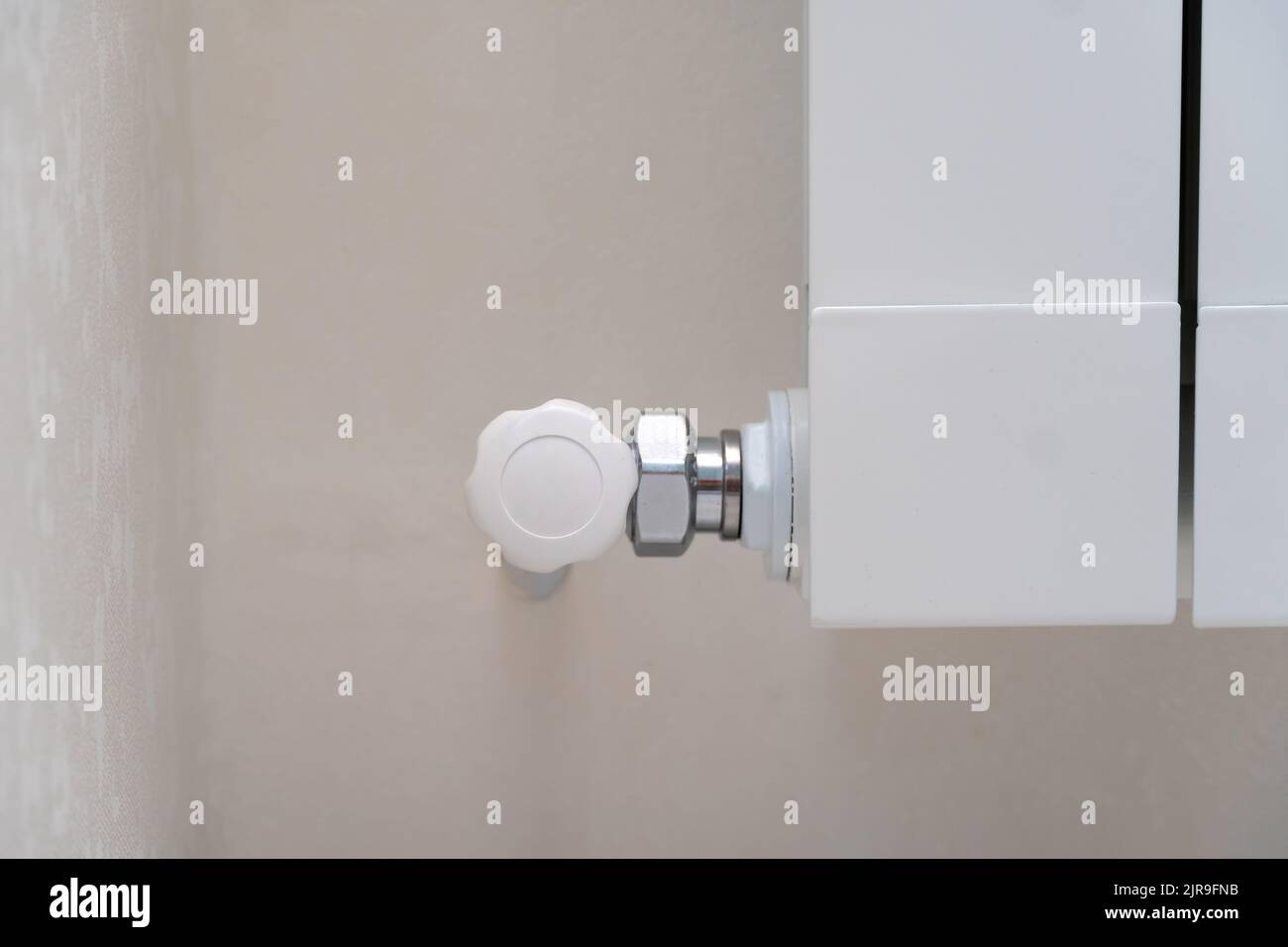 Closeup of the temperature controller of the water heating system in a modern house, light