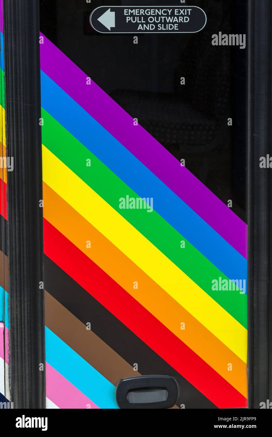 Emergency exit pull outward and slide on side of Pride bus with rainbow ...