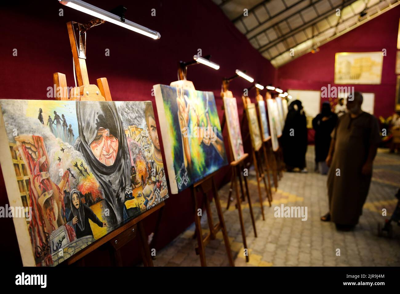 Idlib, Syria. 20th Aug, 2022. Idlib, Syria. 20 August 2022. An art exhibition is held in the opposition-controlled city of Idlib, in northern Syria. The art exhibition included paintings, calligraphy artworks, and mosaics, highlighting the suffering and hopes of Syrians amid the ongoing conflict. Part of the exhibition was dedicated to three-dimensional models of major historical sites of Syria, including the Aleppo Citadel, the Deir ez-Zor suspension bridge, and the Al-Omari Mosque in Daraa. The art exhibition was set up together with the first book fair organised in Idlib since being under Stock Photo
