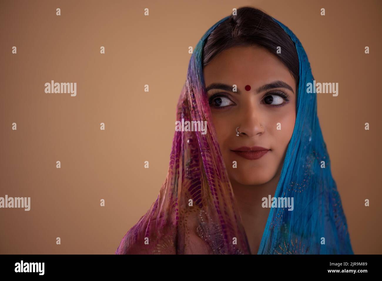 Portrait of an Indian woman in colourful veil Stock Photo