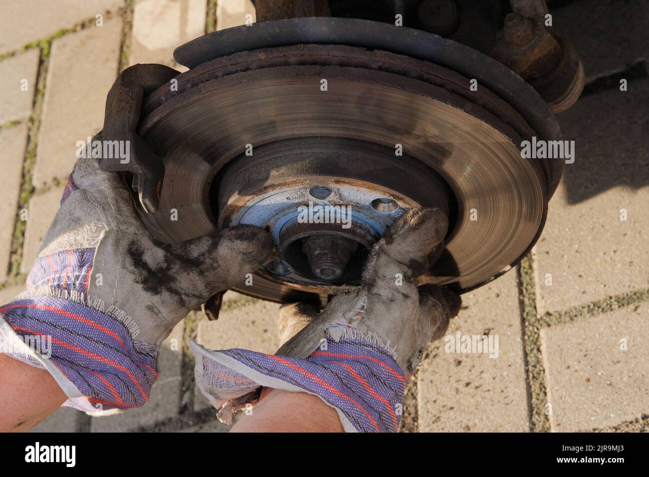 Check brake system of car. Car repair concept. Repair of a wheel on a passenger car. Stock Photo