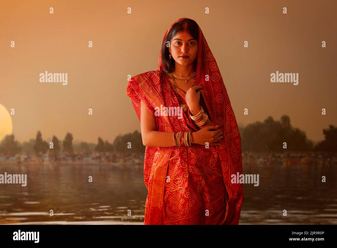 woman from Bihar Standing near Ganga River during  Chhath Puja festival Stock Photo