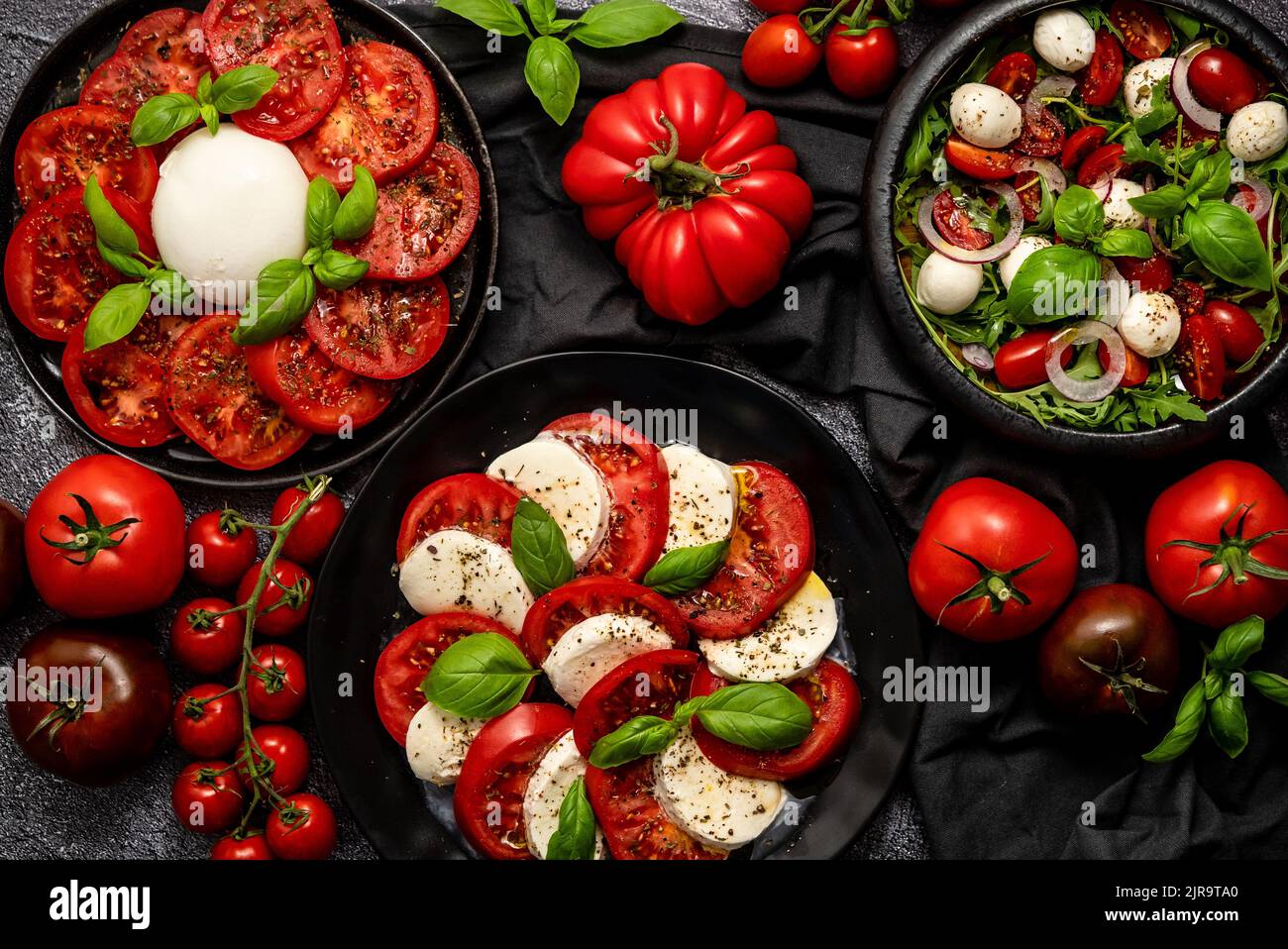Diet and healthy tomato salads with arugula, cherry tomatoes, burrata