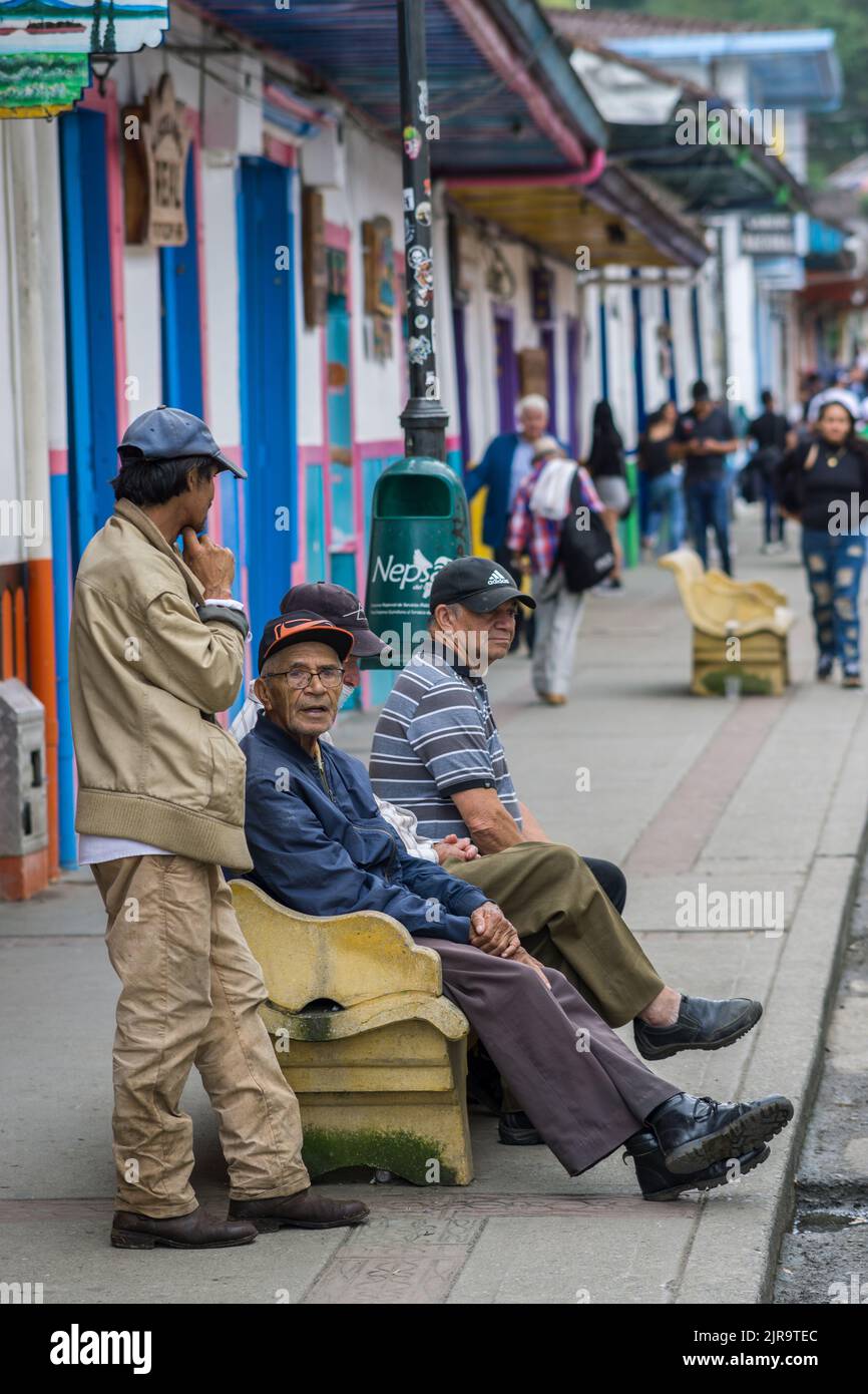 A vertical shot of guys talking in the beautiful Salento, Quindio Stock Photo
