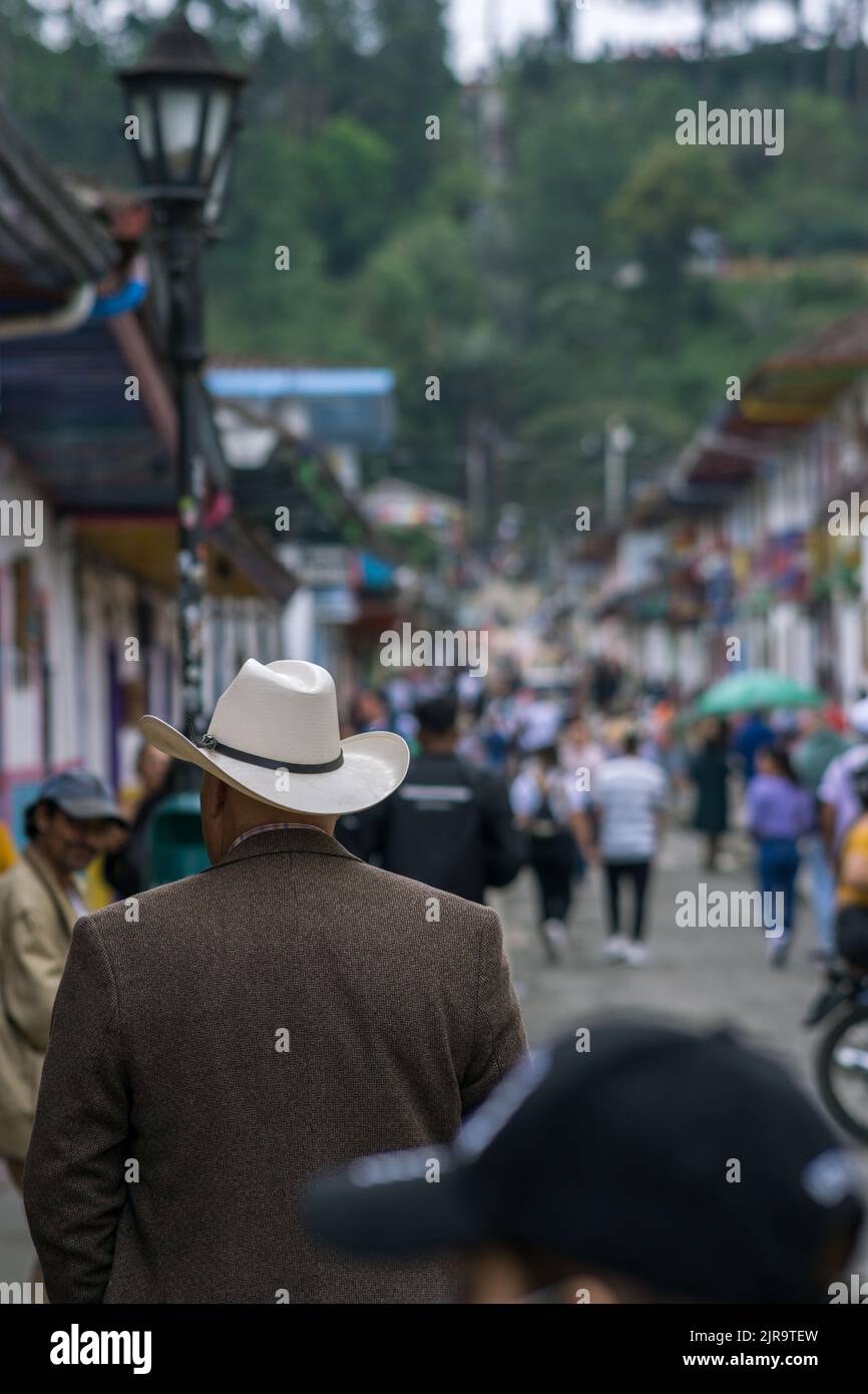 A vertical shot of people walking in the street in Salento, Quindio, Colombia Stock Photo