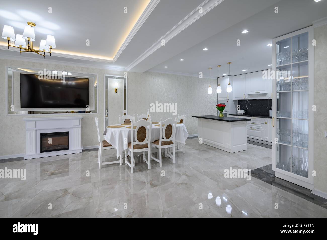Well designed large domestic kitchen with marble floor Stock Photo