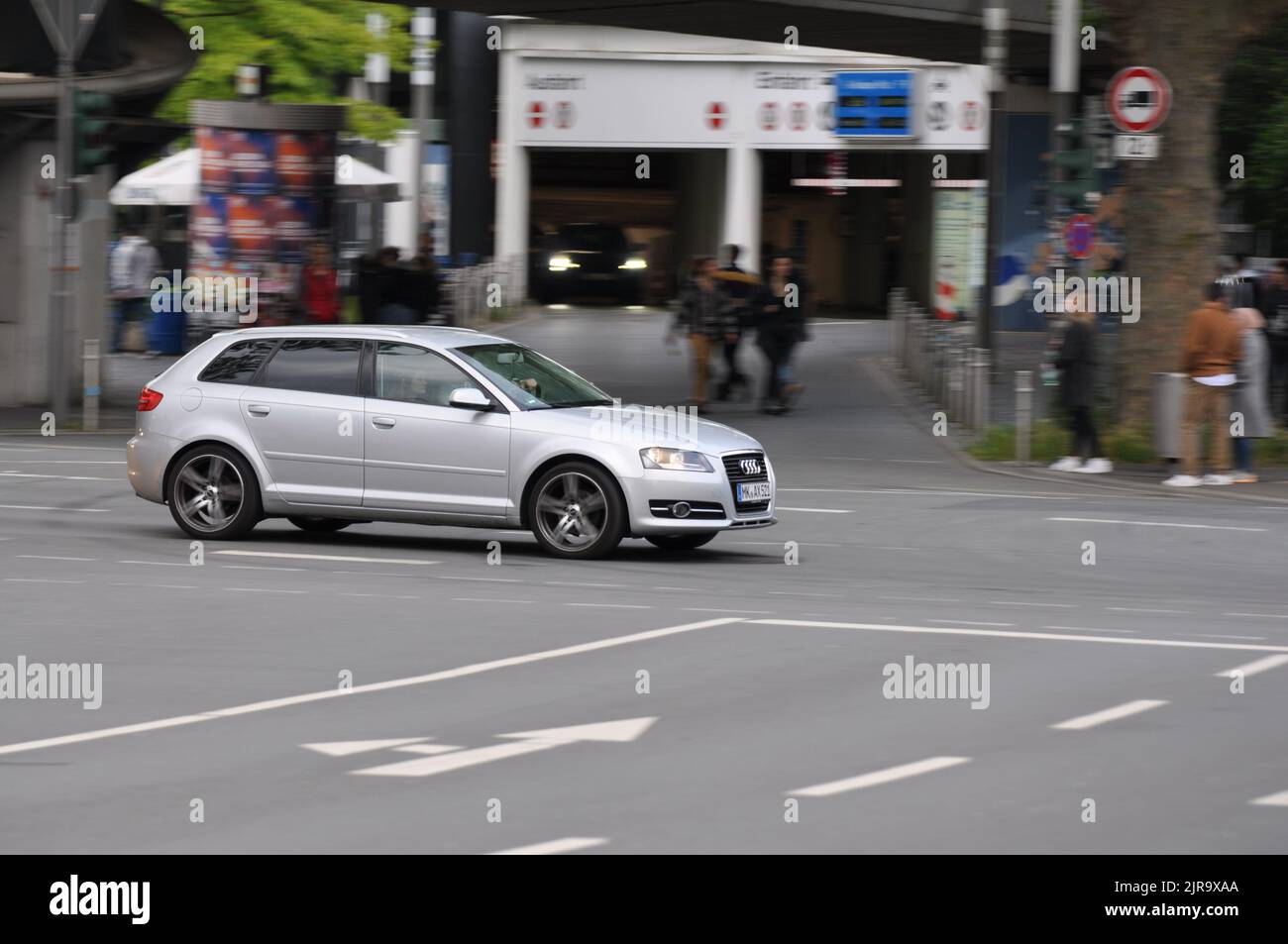 A silver Audi A3 (8P) while driving on intersection in Bochum, Germany. Stock Photo