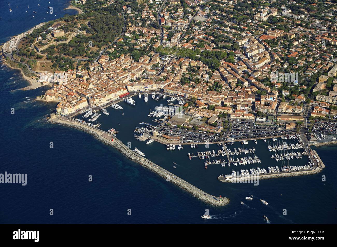 Saint-Tropez, in the Var department (south-eastern France): aerial view of the posh seaside resort on the eponymous peninsula and its marina Stock Photo