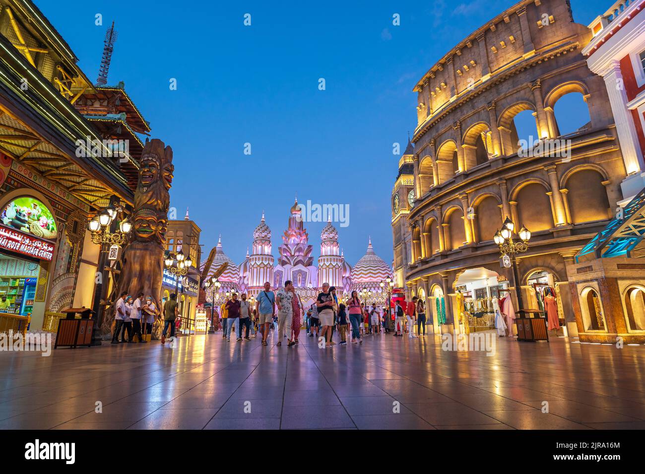 Dubai, United Arab Emirates - April 4, 2022: Crowded Global village in Dubai at sunset. Popular tourist attraction with shops and restaurants from aro Stock Photo