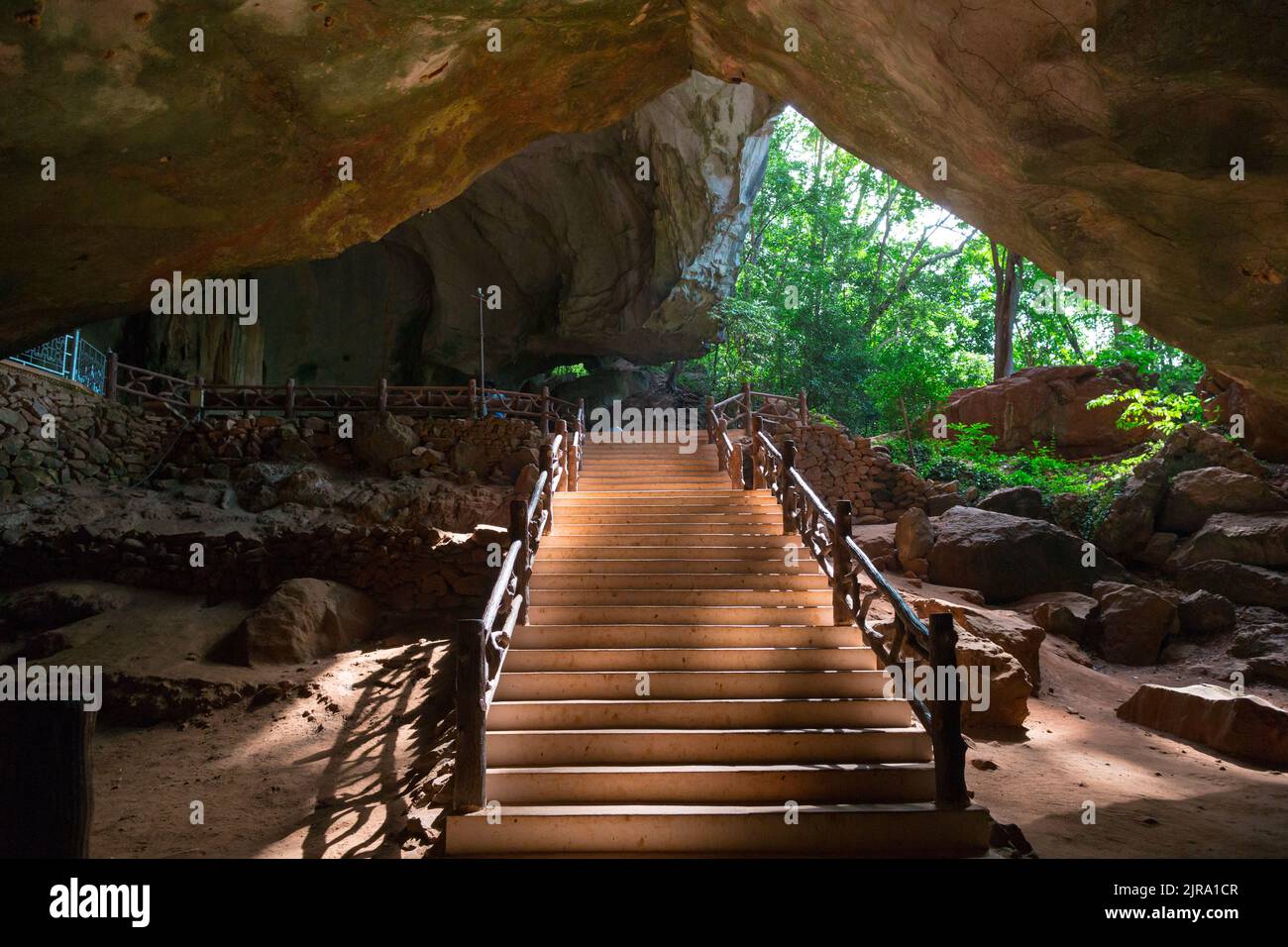 the stone cave entrance, view from inside Stock Photo Alamy