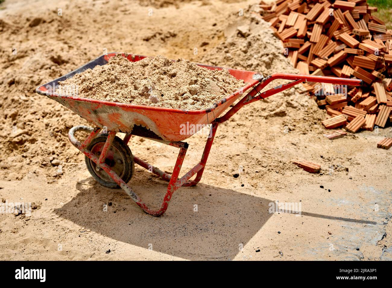 An old funny wheel barrow with only one handle, at a Thai temple. Stock Photo