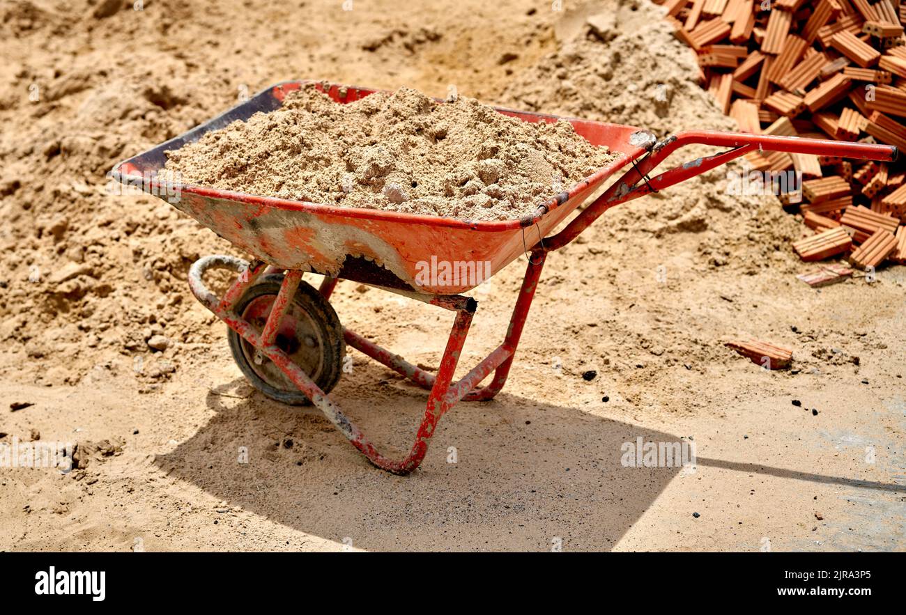 An old funny wheel barrow with only one handle, at a Thai temple. Stock Photo
