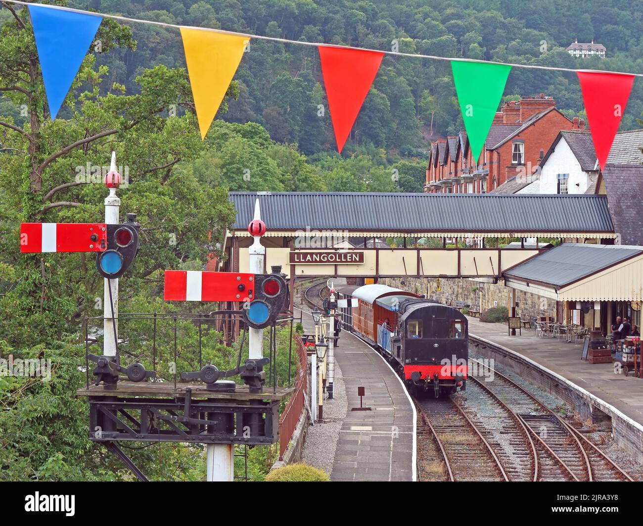 Bunting over Llangollen preserved railway Station, signals, Denbighshire, North Wales, UK, LL20 8SN Stock Photo