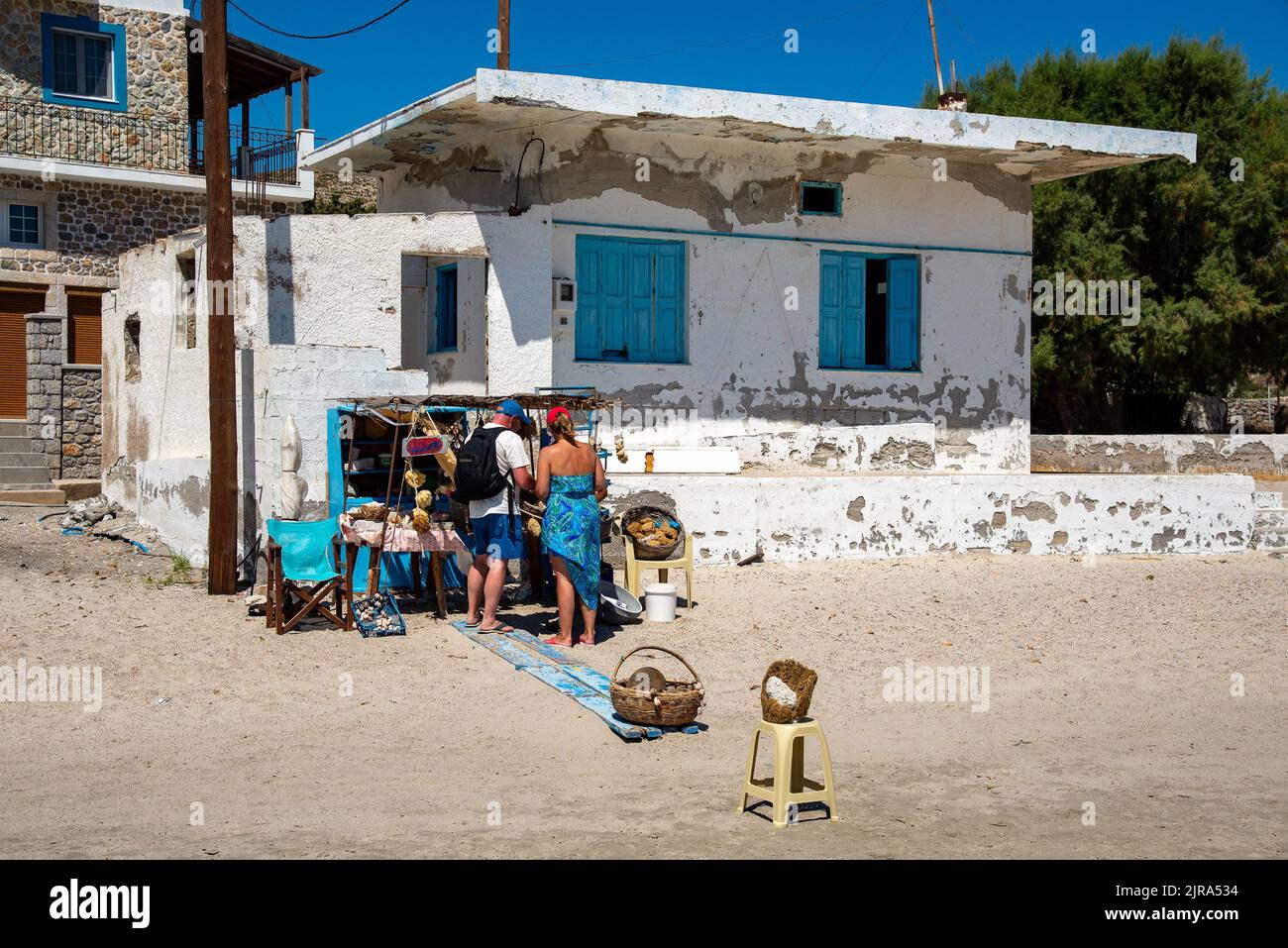 A stall selling sponges on the beach at Pserimos, Kalymnos, Dodecanese, South Aegean, Greece. Stock Photo