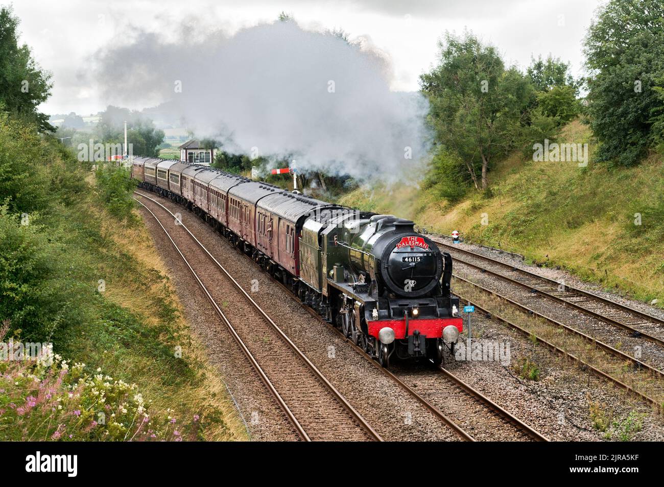 Steam locomotive 'Scots Guardsman' passes Settle Junction signal box and takes 'The Dalesman' train onto the famous Settle-Carlisle railway line. 23rd August 2022.The trip was a day outing to Carlisle with the steam traction hauling the train from Hellifield to Carlisle and return. Credit: John Bentley/Alamy Live News Stock Photo
