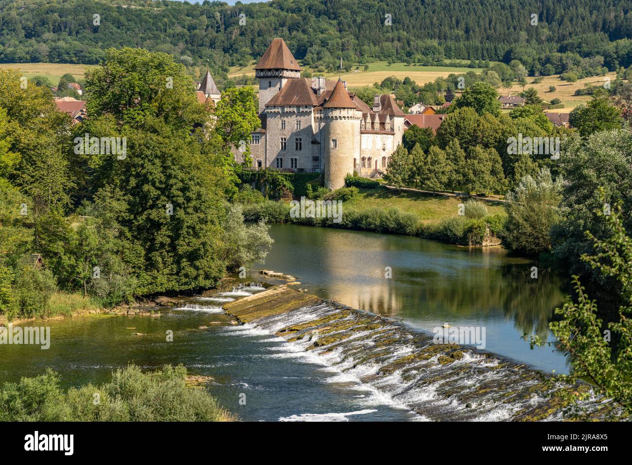 A visitor walking through the tunnel entrance to Chateau de Brancion &  historic village in Saone et Loire, Burgundy, France Stock Photo - Alamy