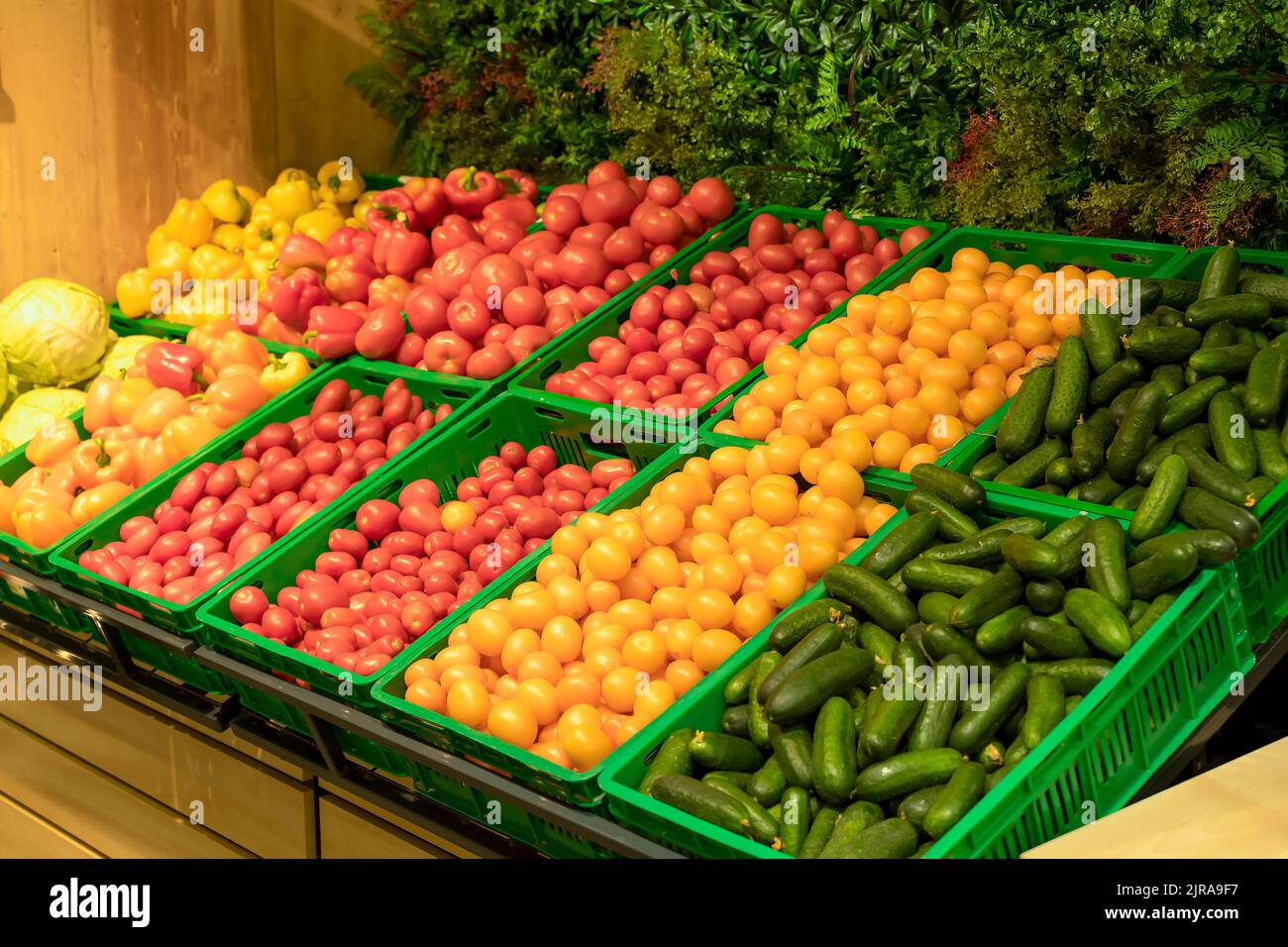 Supermarket vegetables background. Fresh tomatoes and peppers in boxes