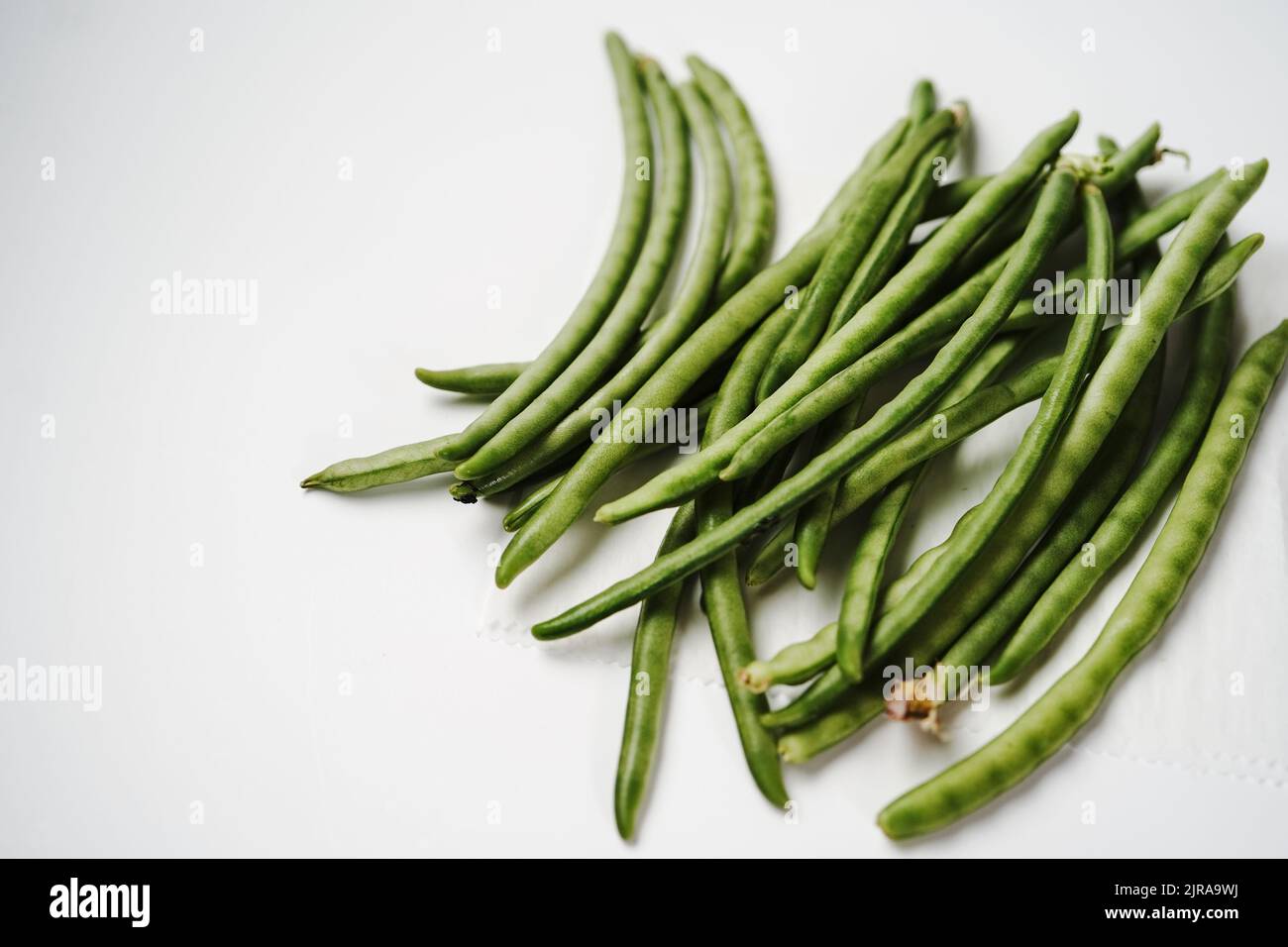 Young string green beans isolated on white background Stock Photo Alamy