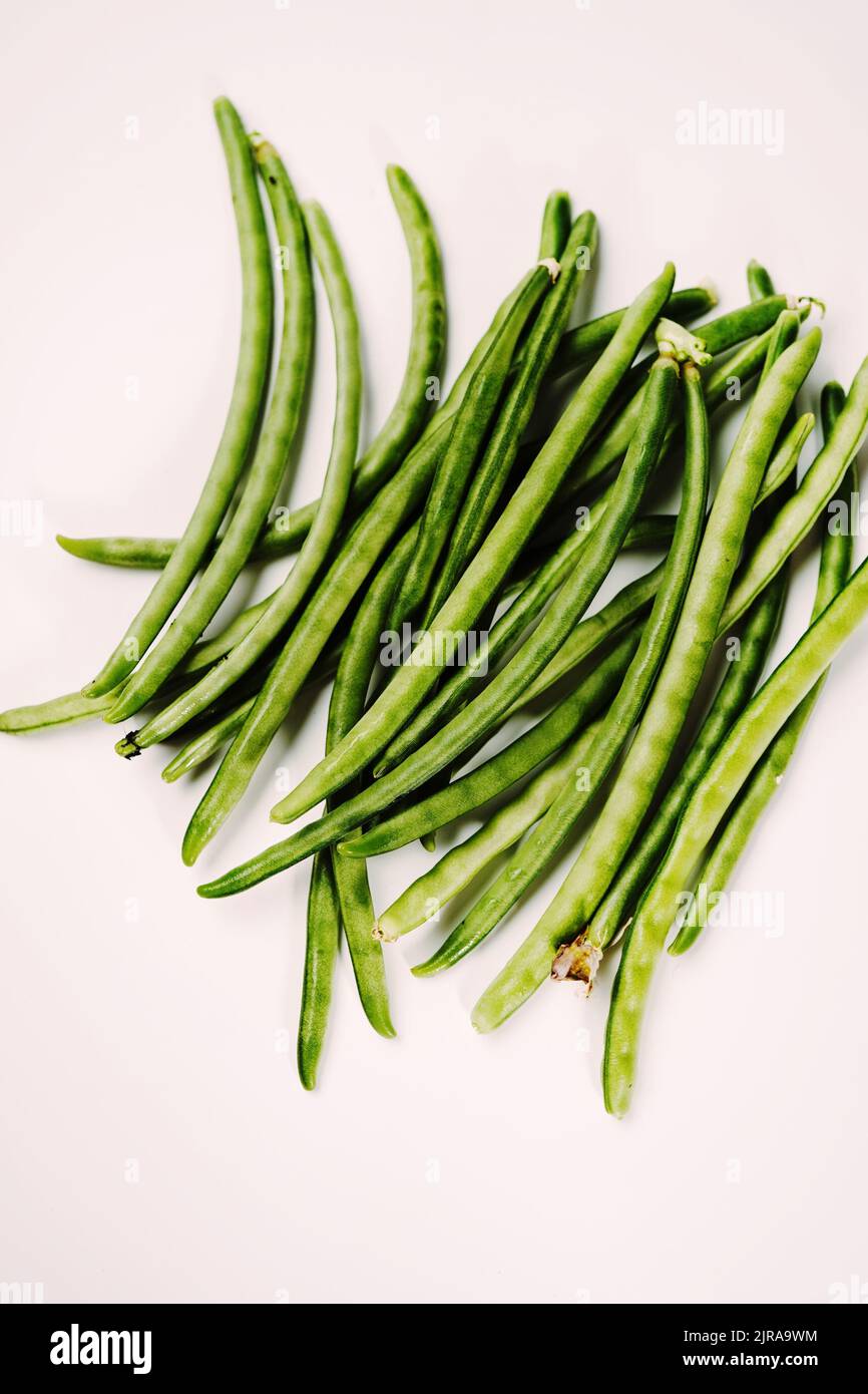 Young string green beans isolated on white background Stock Photo Alamy