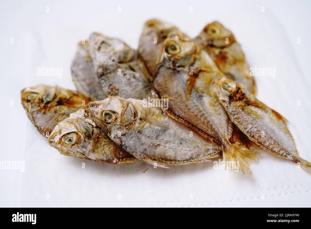 Salted dry fish cod isolated on white background Stock Photo - Alamy