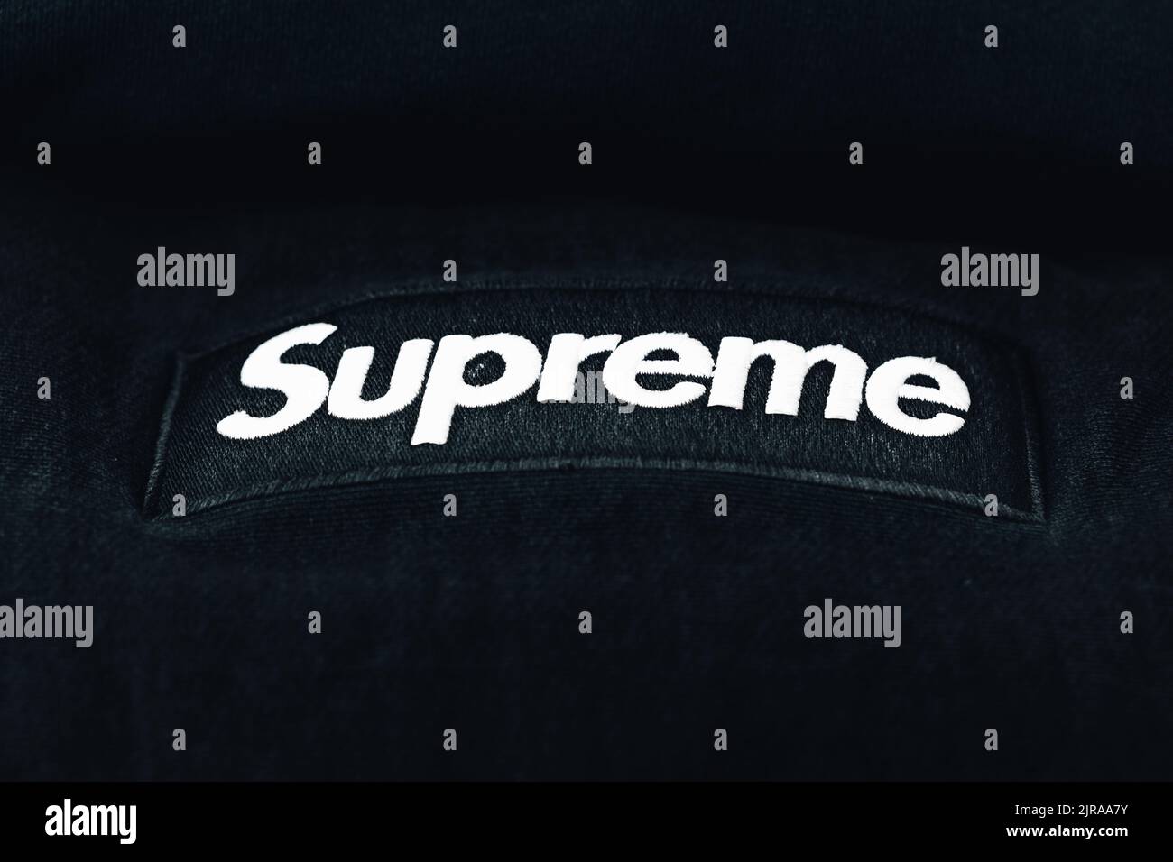 A Black Supreme Hoodie with Box Logo stitched onto it Stock Photo